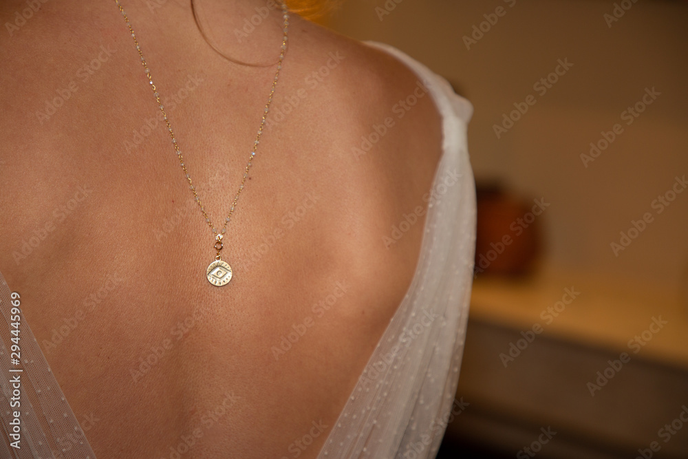 Jewellery on girl neck beautiful gold neck chain in evening dress with necklace back