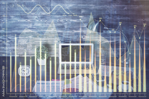 Multi exposure of graph and financial info and work space with computer background. Concept of international online trading. © peshkova