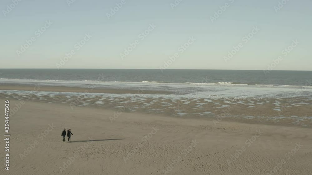 Dunkirk beach, two people and seagulls (Dunkerque, France) d-log Dunkirk beach, two people and seagulls (Dunkerque, France) d-log