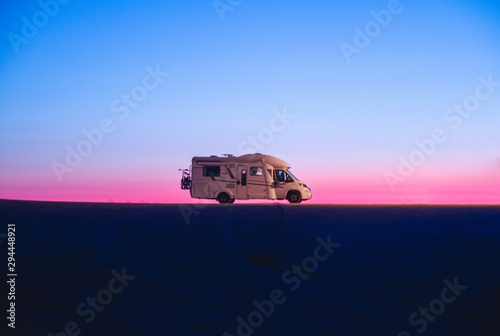 Obraz na plátne Adventure campervan motor home at sunset