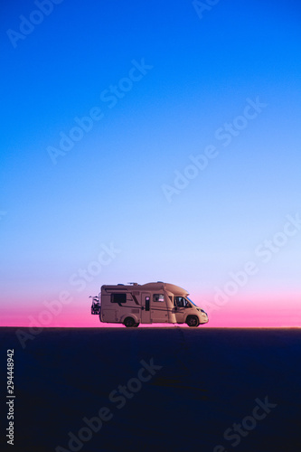 Fotografie Adventure campervan motor home at sunset
