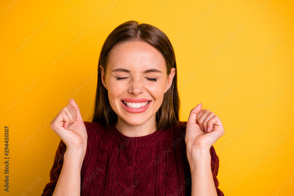 Photo of rejoicing charming cute girl happy with winning some prize knowing result while isolated with yellow background Photo of rejoicing charming cute girl happy with winning some prize knowing result while isolated with yellow background