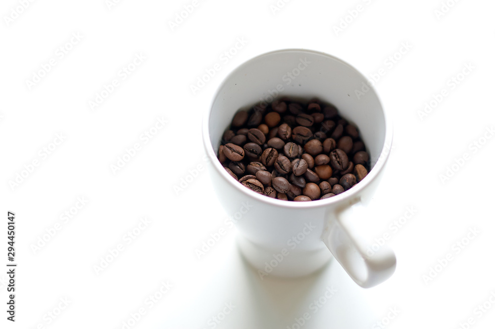 A cup is filled with coffee grains instead of a drink. A cup is filled with coffee grains instead of a drink.