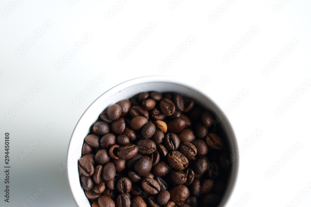 Part of a bowl with coffee grains. Part of a bowl with coffee grains.