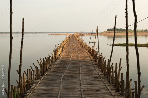 Fotografi Old traditional bamboo wooden bridge across Mekong river, Kampong Cham, Cambodia
