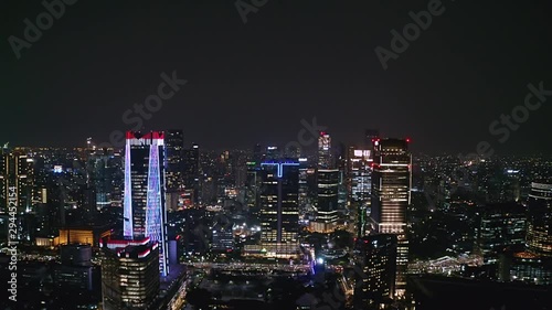 Wallpaper Mural JAKARTA, Indonesia - October 03, 2019: Exotic aerial view of business district with night lights and modern skyscrapers. Shot in 4k resolution from a drone flying forwards Torontodigital.ca