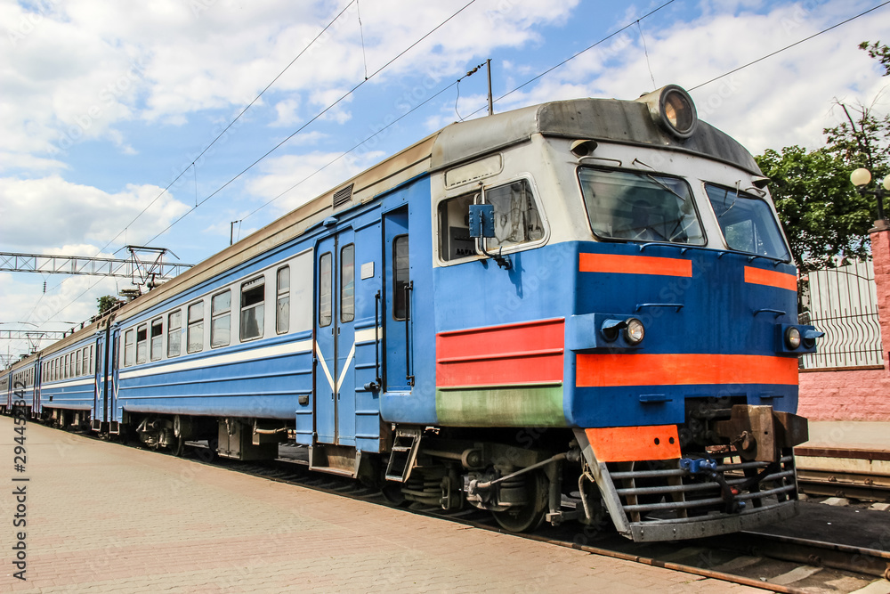 Train on railway station with sky on background