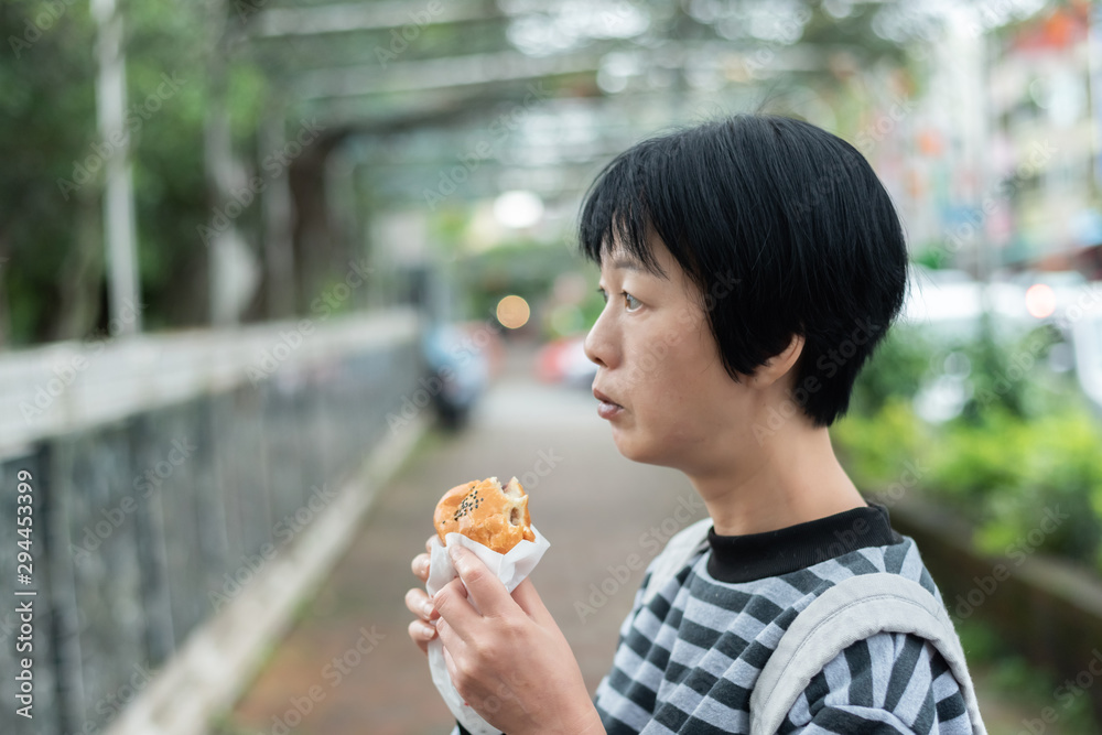 woman eat traditional Taiwanese snack woman eat traditional Taiwanese snack