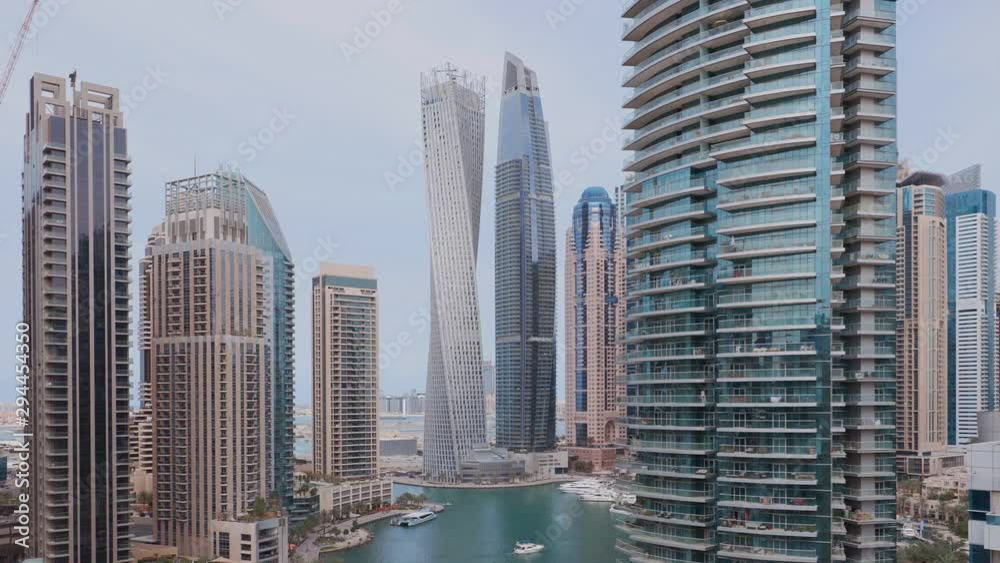 Aerial paniramic view of Dubai Marina residential and office skyscrapers with waterfront. Floating boats and yachts Aerial paniramic view of Dubai Marina residential and office skyscrapers with waterfront. Floating boats and yachts
