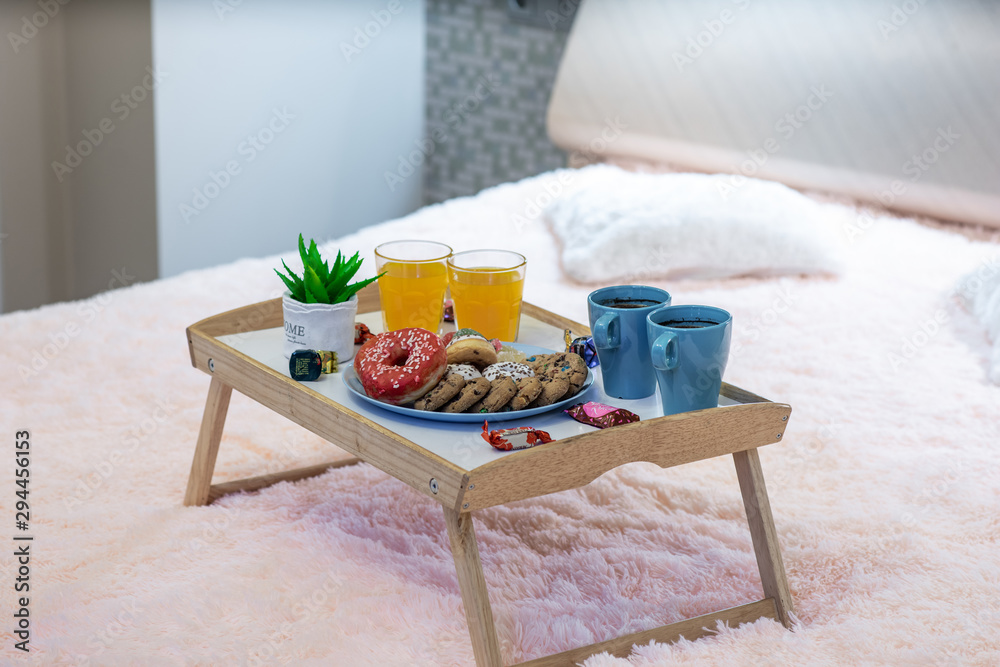 Close-up of tray with food. Romantic breakfast composition.
