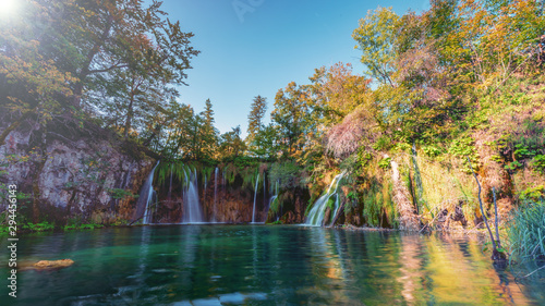 Fototapeta Naklejka Na Ścianę i Meble -  panoramic waterfalls in autumn with crystal clear lake 