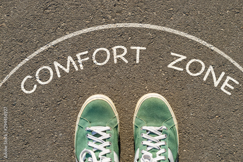 photo on top of the sneakers and the inscription comfort zone on the asphalt, the concept of personal private space