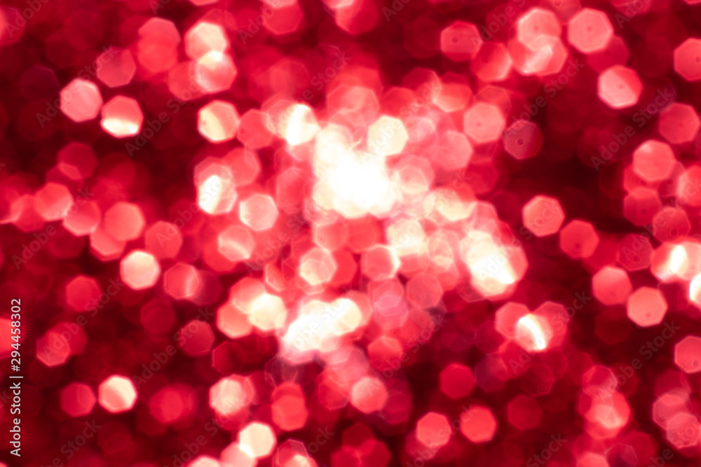 Red glitter festive background with bokeh lights. Celebration concept for Holidays and anniversary.