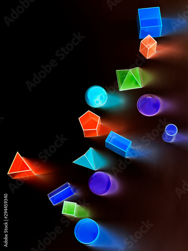 Colorful luminescent geometric shapes on black background photo