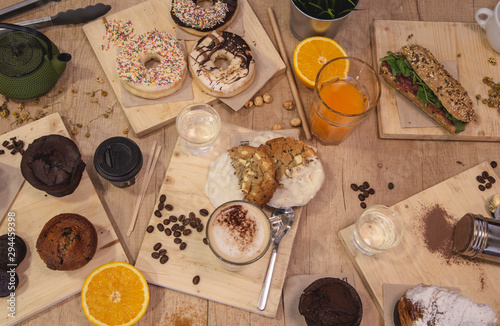 Variety of assortment of coffee shop confectionery on wooden background. Top view © jcalvera