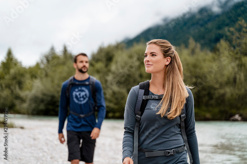 Young couple on a hiking trip at riverside, Vorderriss, Bavaria, Germany © Westend61
