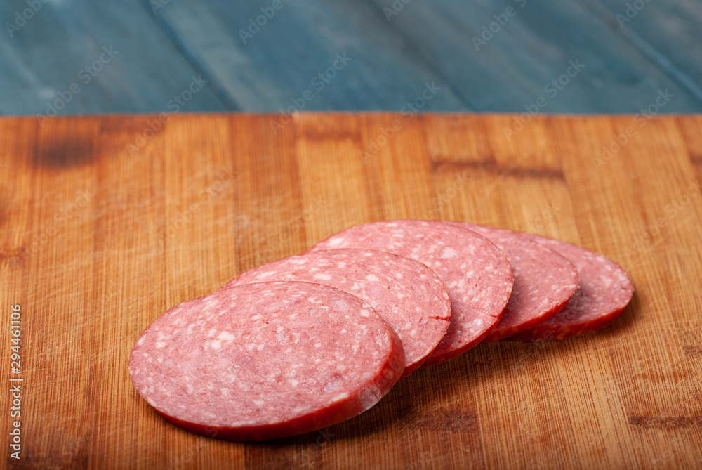 Sausage cut into slices on a cutting Board Sausage cut into slices on a cutting Board