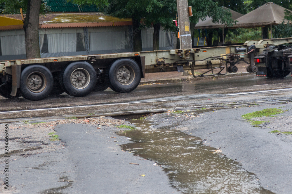 Flow of water during heavy rain and clogging of street sewage. The flow of water during a strong hurricane in storm sewers. Sewage storm system along the road to drain rain into the drainage system Flow of water during heavy rain and clogging of street sewage. The flow of water during a strong hurricane in storm sewers. Sewage storm system along the road to drain rain into the drainage system