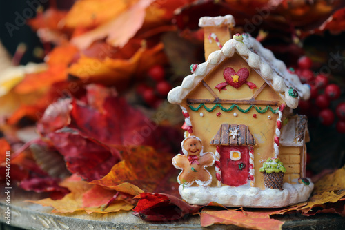 christmas gingerbread cookies and decorations with dolls and autumn leaves 