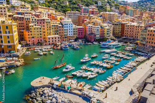 Aerial view of Camogli. Colorful buildings near the ligurian sea beach. View from above on boats and yachts moored in marina with green blue water. © vladim_ka