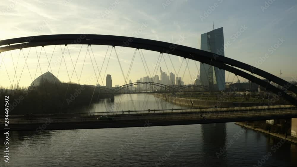 Frankfurt ECB Skyline Aerial Shot following a car over a bridge revealing skyscraper city in 4k Frankfurt ECB Skyline Aerial Shot following a car over a bridge revealing skyscraper city in 4k