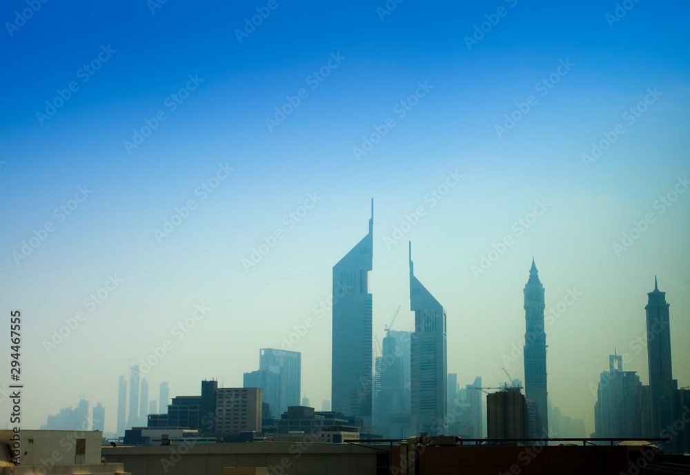 modern buildings in Dubai city under blue sky
