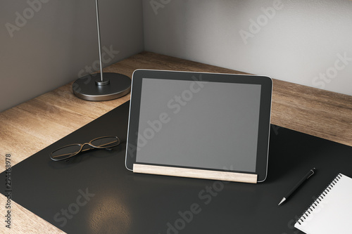 Creative designer desktop with empty tablet