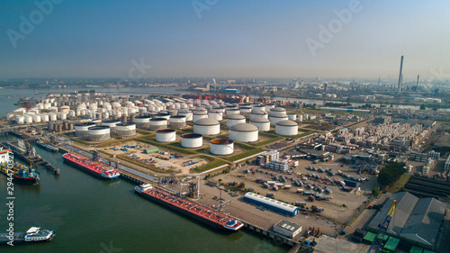 Oil refinery plant from industry zone, Aerial view oil and gas industrial, Refinery factory oil storage tank and pipeline steel