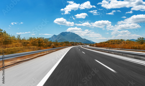 High-speed highway in beautiful mountainous terrain in sunny day. © Denis Rozhnovsky