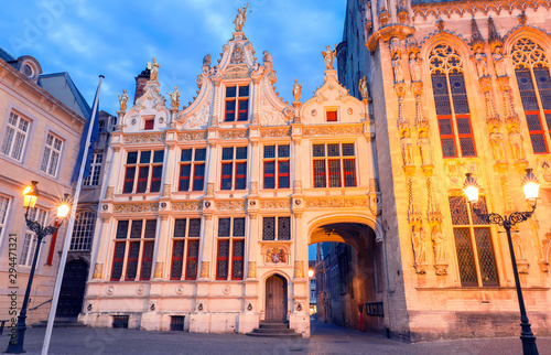 Scenic cityscape with the night medieval Burg Square in Bruges, Belgium.