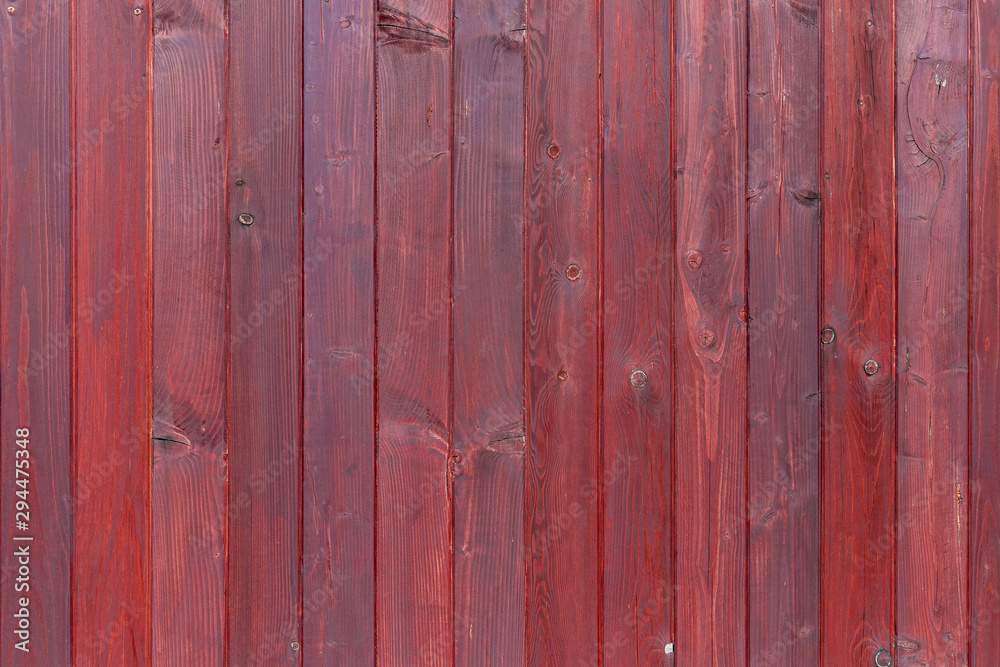 The old red wood texture with natural patterns The old red wood texture with natural patterns
