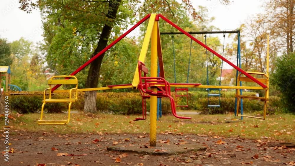 motion of an empty children's carousel. the carousel moves at an average speed counterclockwise. autumn. full hd, no sound. motion of an empty children's carousel. the carousel moves at an average speed counterclockwise. autumn. full hd, no sound.