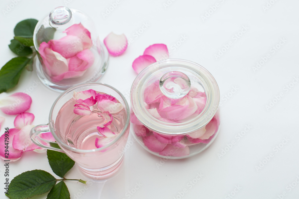Rose petals tea in a white background. Horizontal Rose petals tea in a white background. Horizontal