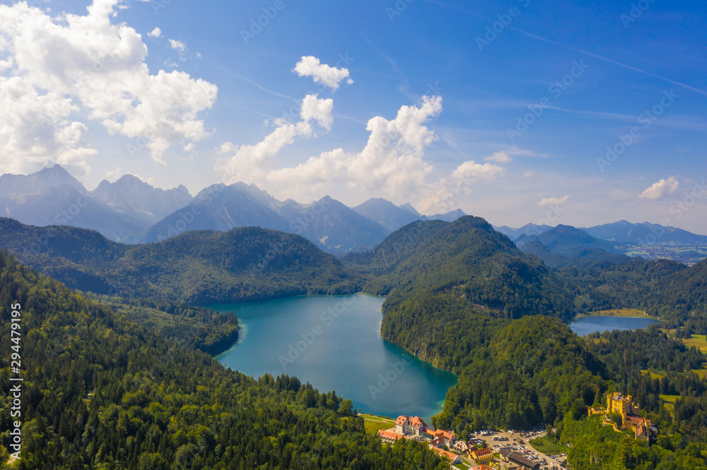 Aerial view on Alpsee lake and Hohenschwangau Castle, Bavaria, Germany. Concept of traveling and hiking in German Alps.