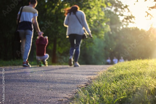 Happy family for a walk in the park