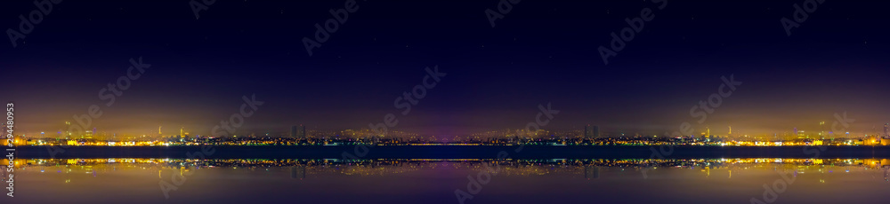 Spectacular nighttime skyline of a big modern city at night .