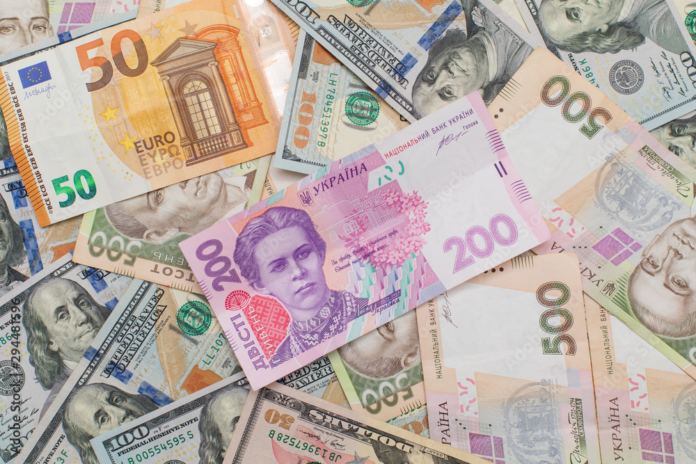 Multi currency money dollars and hryvnia, close-up top view concept finance investment Multi currency money dollars and hryvnia, close-up top view concept finance investment