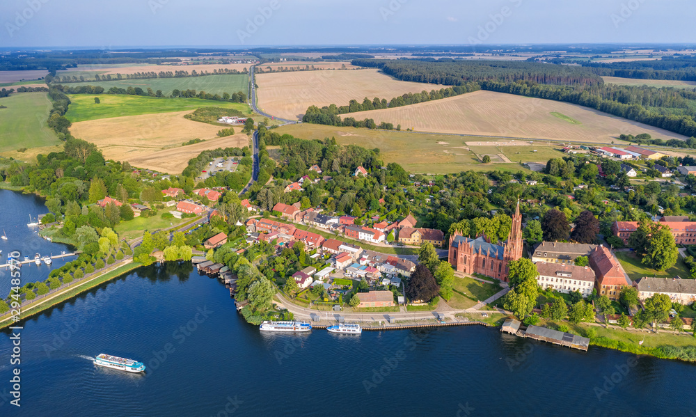 Fototapeta premium Aerial panoramic view of the beautiful town of Malchow in the Mecklenburg Lake District, Germany