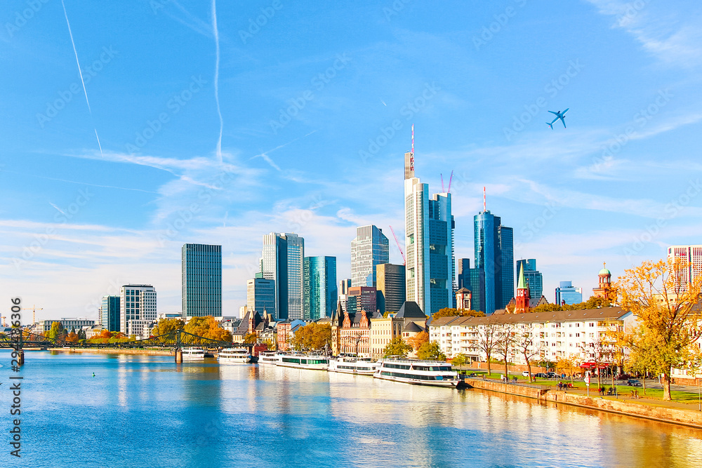Skyline cityscape of Frankfurt, Germany during sunny day with a plane. Frankfurt am Main is a financial capital of Europe. - obrazy, fototapety, plakaty 