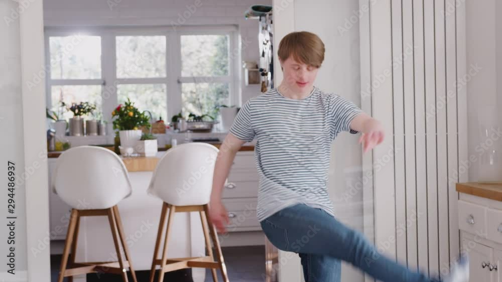 Young Downs Syndrome Man Having Fun Dancing At Home Young Downs Syndrome Man Having Fun Dancing At Home
