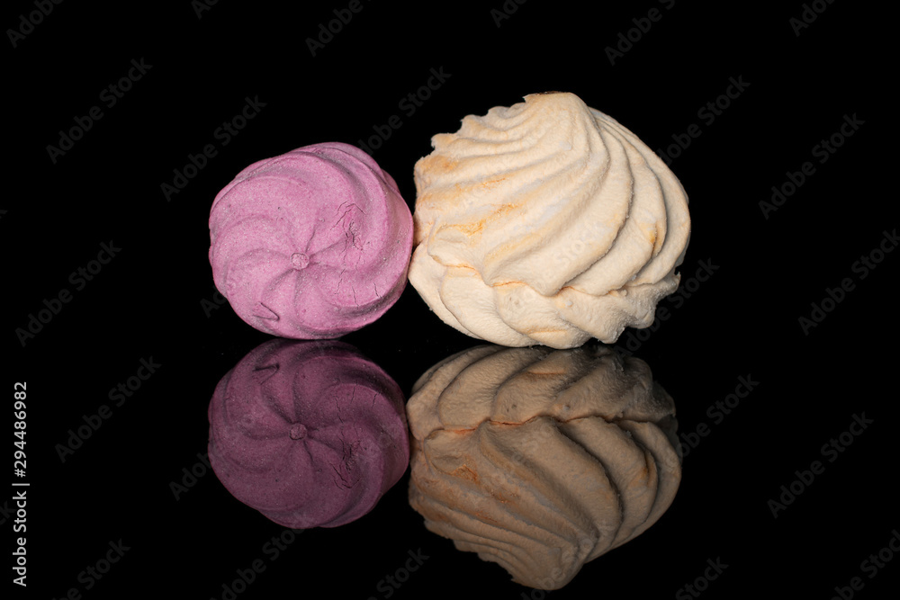 Group of two whole fresh pastel zefir isolated on black glass Group of two whole fresh pastel zefir isolated on black glass