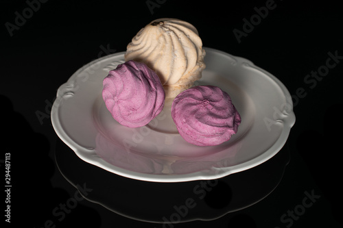 Wallpaper Mural Group of three whole airy fresh pastel zefir on white plate isolated on black glass Torontodigital.ca