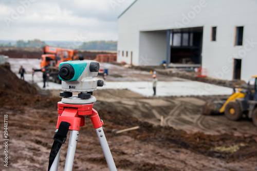 Surveyor equipment at a construction site. Measuring instrument close-up.