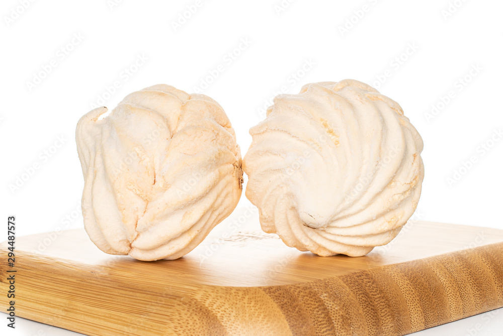 Group of two whole apricot fresh pastel zefir on wooden square plate isolated on white background Group of two whole apricot fresh pastel zefir on wooden square plate isolated on white background