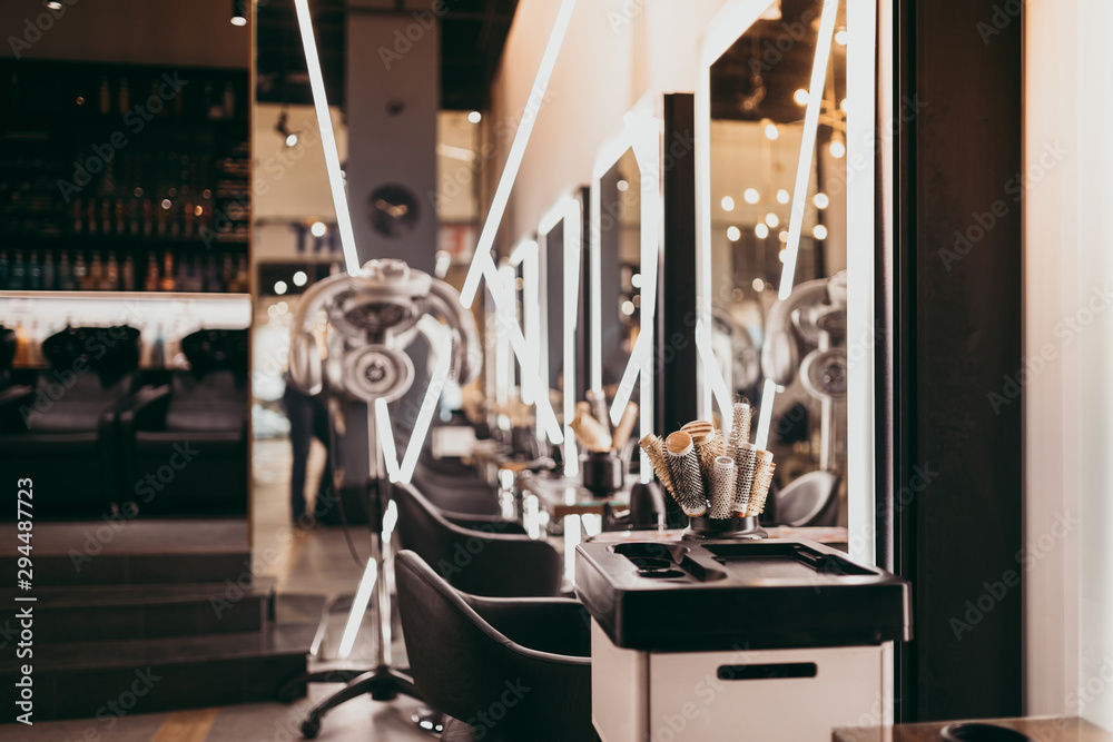 Interior of modern and fashionable hair salon. - obrazy, fototapety, plakaty 