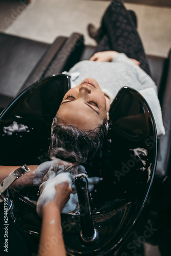 Принти на полотні Beautiful young woman getting a hair wash