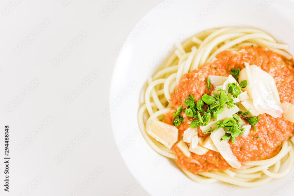 Italian pasta with tomato sauce, parmesan cheese, fresh oregano - on white background. Italian pasta with tomato sauce, parmesan cheese, fresh oregano - on white background.