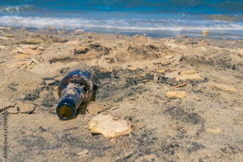 bottle on the beach became trash