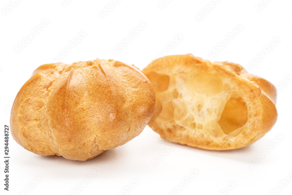 Group of one whole one half of baked golden profiterole isolated on white background Group of one whole one half of baked golden profiterole isolated on white background