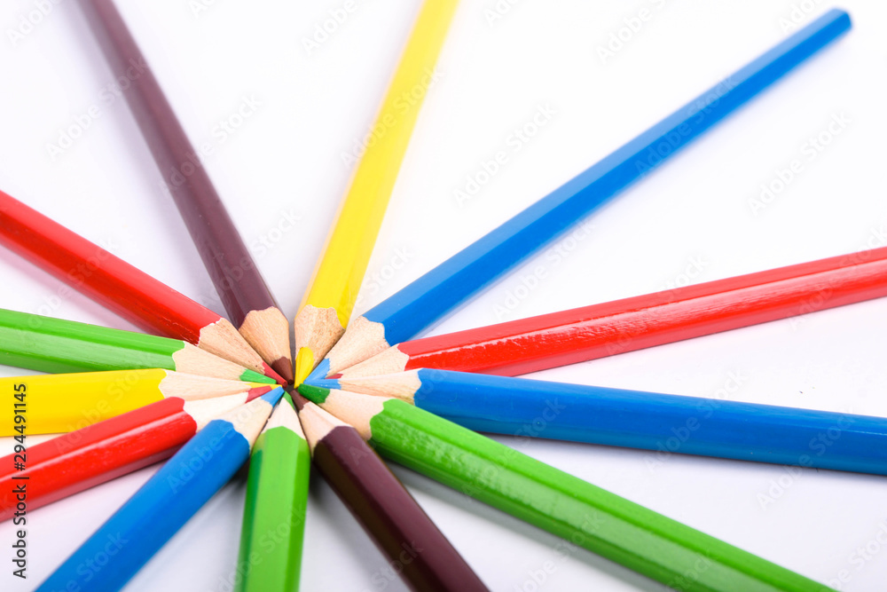 Many different colored pencils on a white background with a place for text and cory space . Many different colored pencils on a white background with a place for text and cory space .